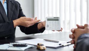 Lawyers negotiating and calculating compensation in car accident 