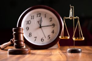 Problems with legal system, delay or slow in judicial justice system by using judge hammer, balance scale and wall clock