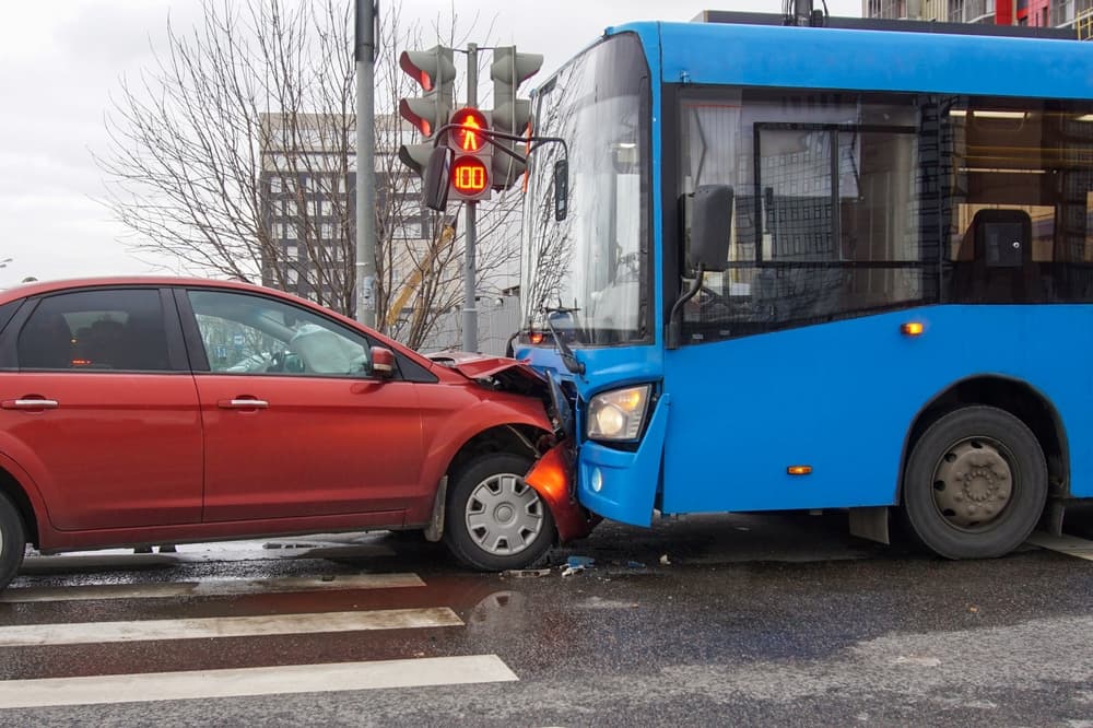 Frontal collision of a car and a bus. Head-on collision between bus and car.