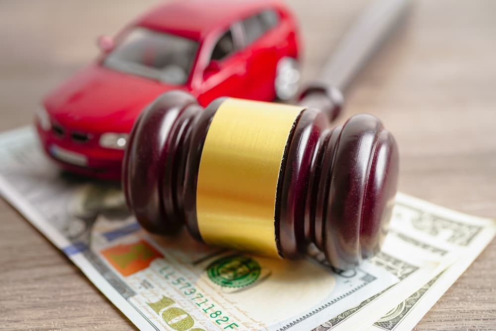 Gavel, Dollar and car- Car Insurance Claim Concept
