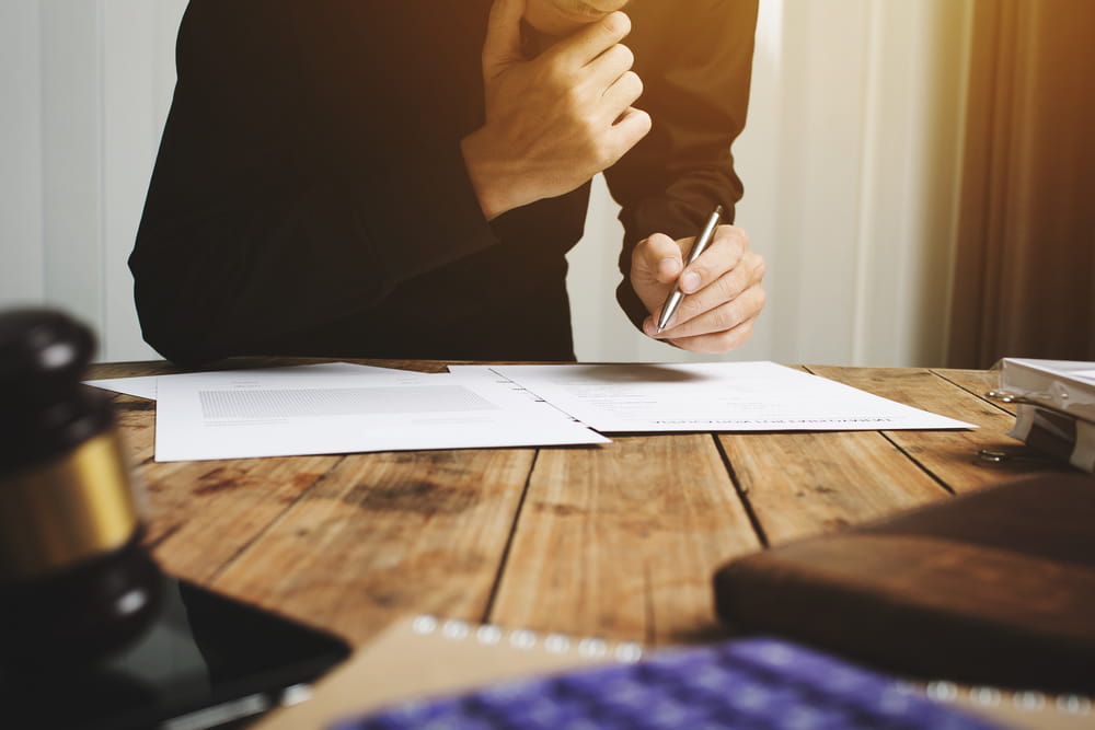 Attorney reviewing car accident injury claim documents in New Hampshire