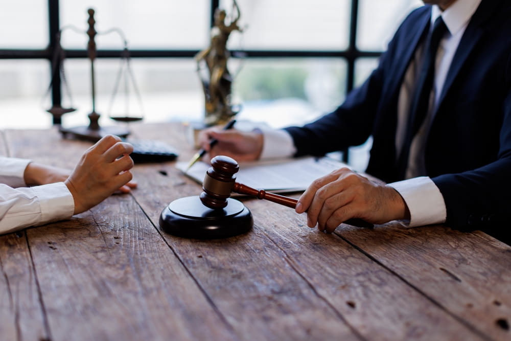 Car accident lawyer consultation discussing fault and injury claim in New Hampshire