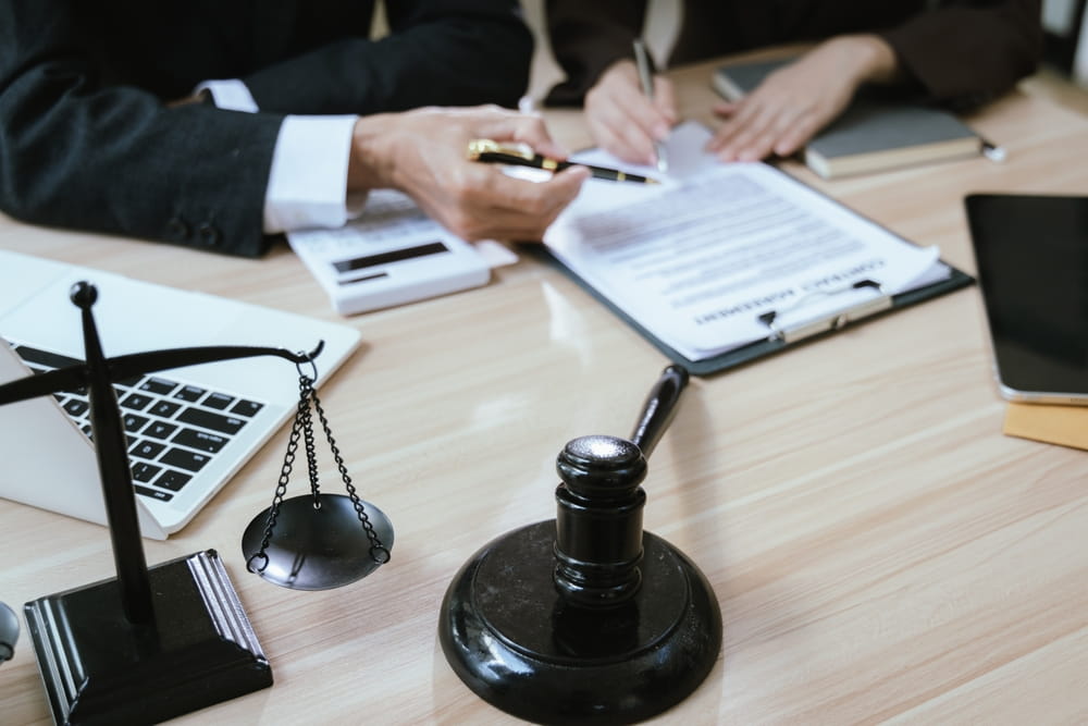 Attorney reviewing distracted driving accident injury claim in New Hampshire