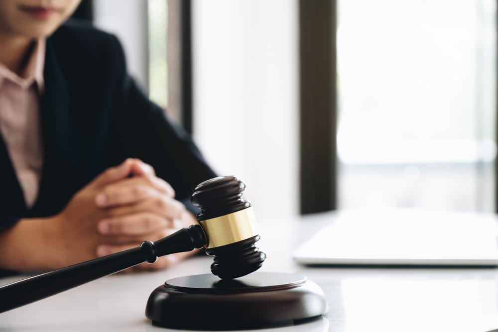 Judge’s gavel on a desk during a legal consultation about insurance disputes and personal injury claims.