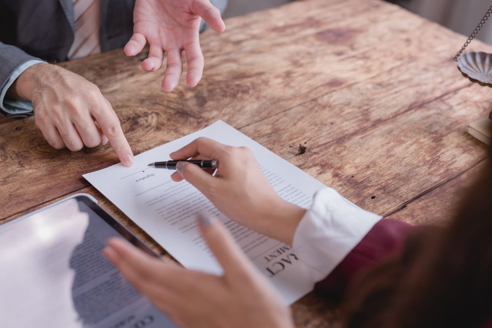 Attorney and client reviewing a personal injury settlement offer